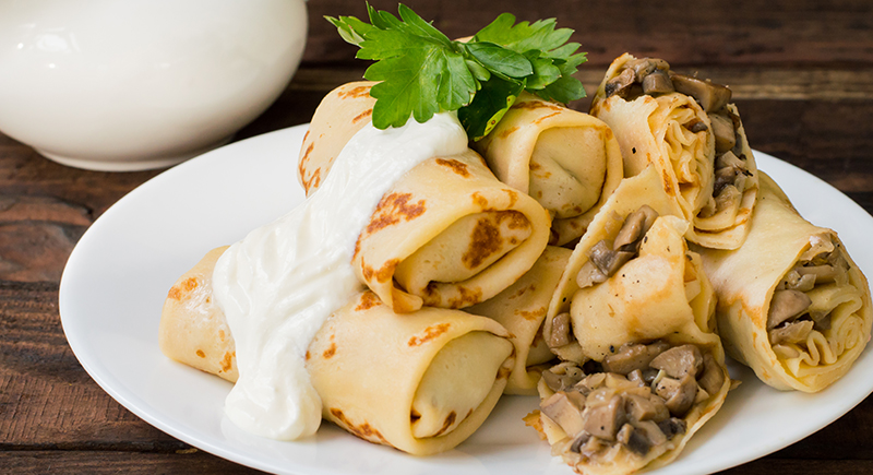 Cannoli di crepes ai funghi e besciamella